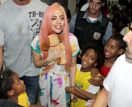 Lady Gaga visits slums in Rio and is mobbed by fans