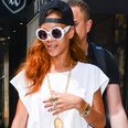Rihanna wearing a white roman dress