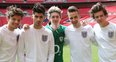 One Direction wearing the England football kit