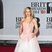 Ellie Goulding rocks the Disney princess look in this pink and white dress.